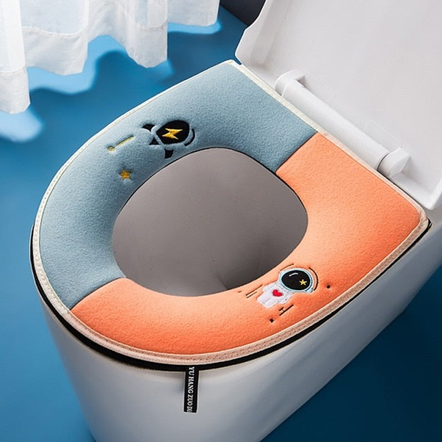 Tapis de siège de toilette astronaute bleu et orange