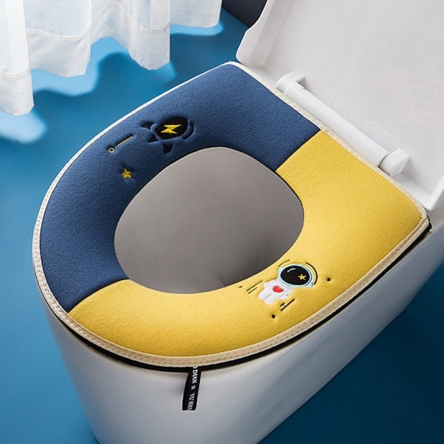 Tapis de siège de toilette astronaute bleu et jaune